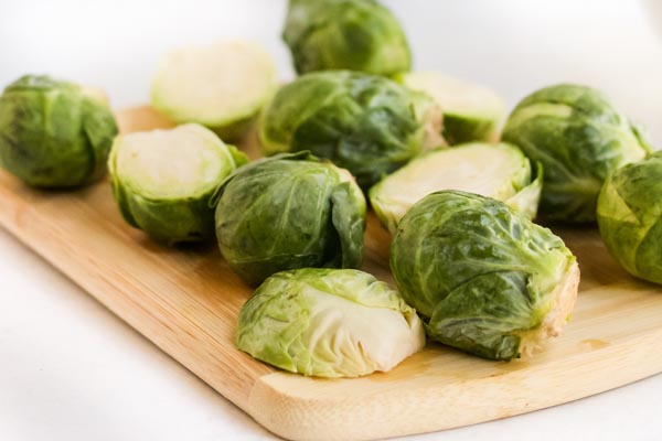 sliced brussels sprouts on a board