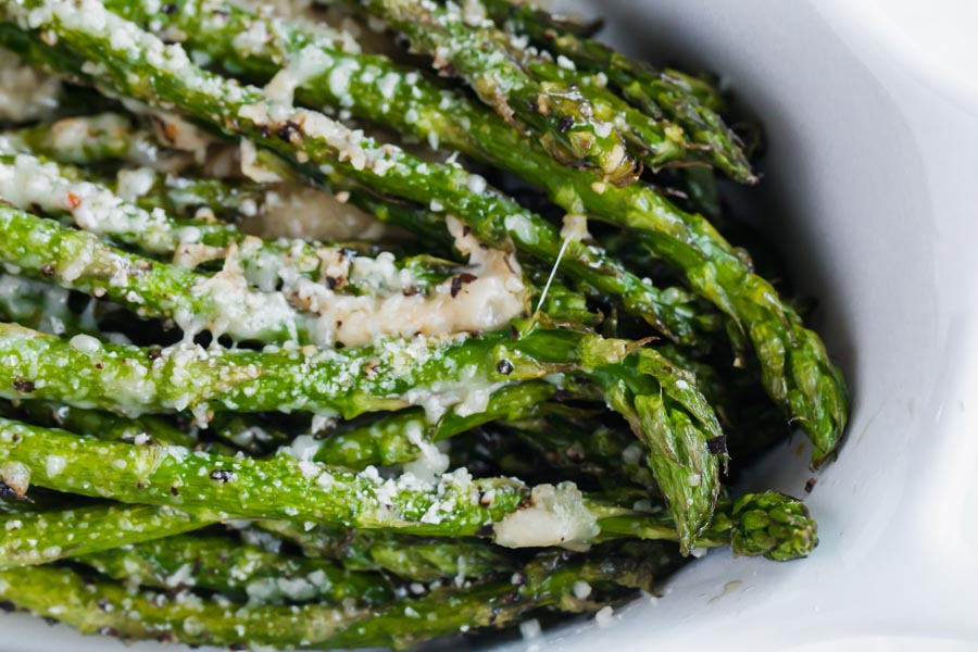 close up of roasted asparagus with parmesan cheese