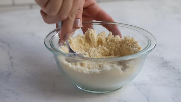 mixing the almond flour fry batter with a spoon