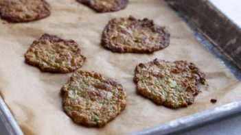 baked avocado chips on a parchment lined tray