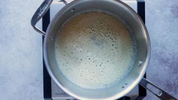 a roux simmering in a saucepan