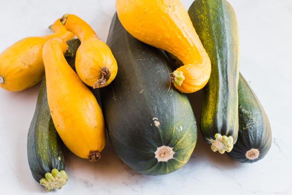 raw zucchini in a spread with yellow squash