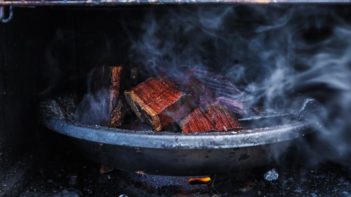 smoke coming off wood in a smoker