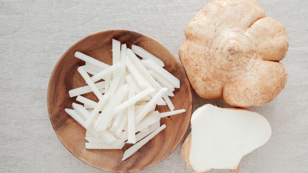 jicama cut into shoestring French fries on a plate