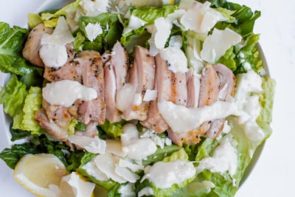 chicken caesar salad ingredients in bowl