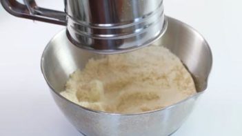 dry ingredients sifted over a silver bowl