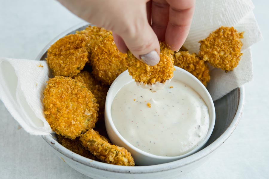 dipping low carb air fryer pickle into ranch