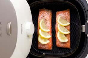 salmon fillets in an air fryer basket