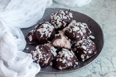 plate of keto almond joy candied truffles