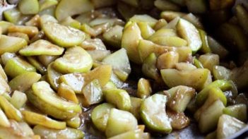 cooking zucchini apples in a skillet