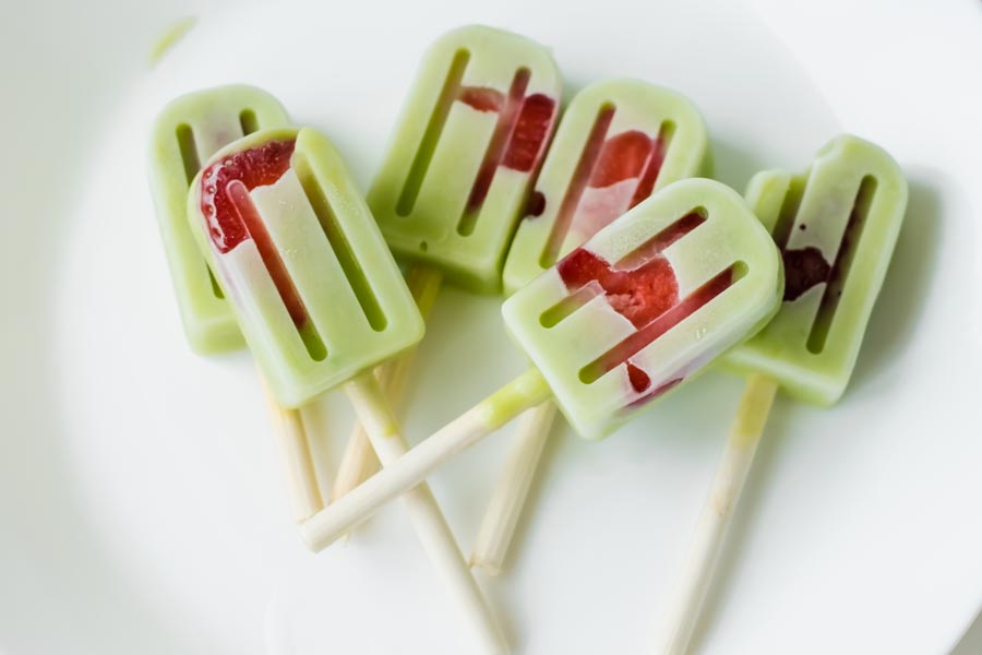 strawberry avocado pops on a white plate