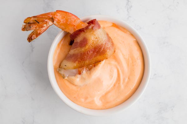 shrimp sitting in sriracha mayo