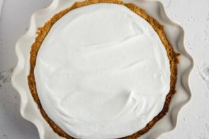 homemade whipped cream spread on top of keto banana cream pie