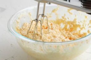 mixing keto banana nut bread batter in a large bowl