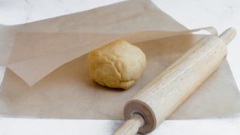 layer dough between parchment paper