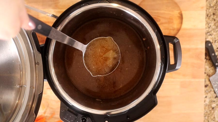 ladeling pho bone broth