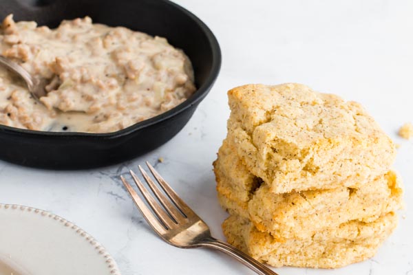 pan with keto sausage gravy and side of biscuits