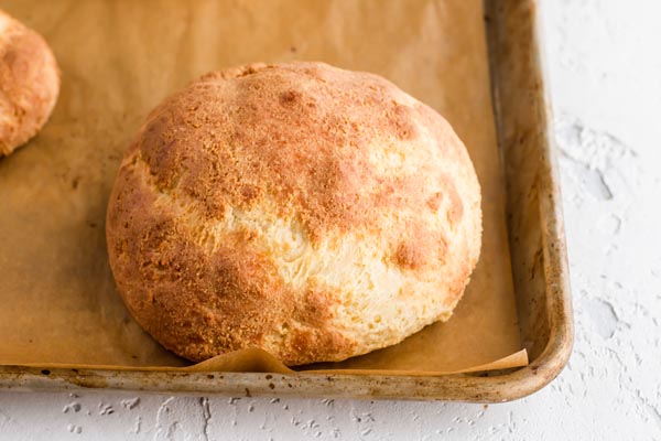 big keto roll on a baking tray