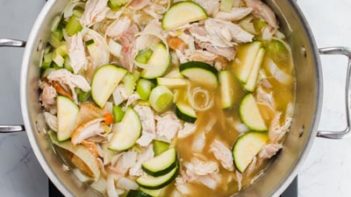 chicken soup simmering on the stove