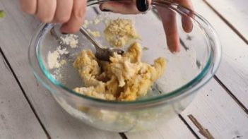 stirring noodle mixture with a spoon