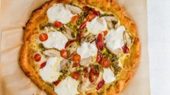 A keto-friendly chicken pesto pizza ready to eat