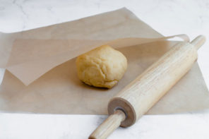 Keto chicken pot pie turnover dough in a ball on parchment paper