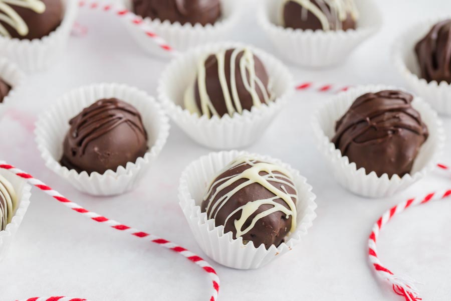 a bunch of chocolate sugar free truffles with christmas rope