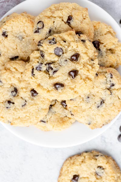 chocolate chip cookies stacked on a white plate