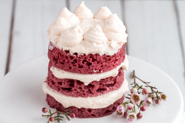 keto red velvet tiered mug cake with whipped cream