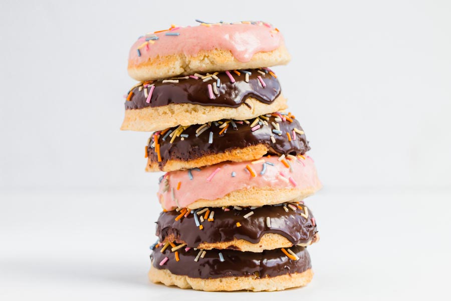 a stack of low carb donuts that are glazed and have sprinkles