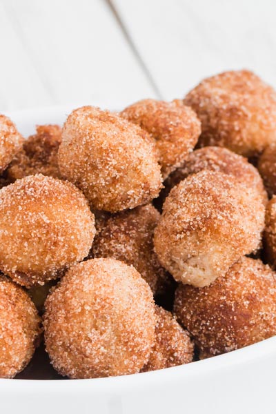 cinnamon sugar donut holds piled on top of each other