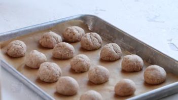 baked keto churro bites on a parchment lined baking tray