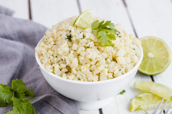 a bowl of rice in a white asian noodle bowl