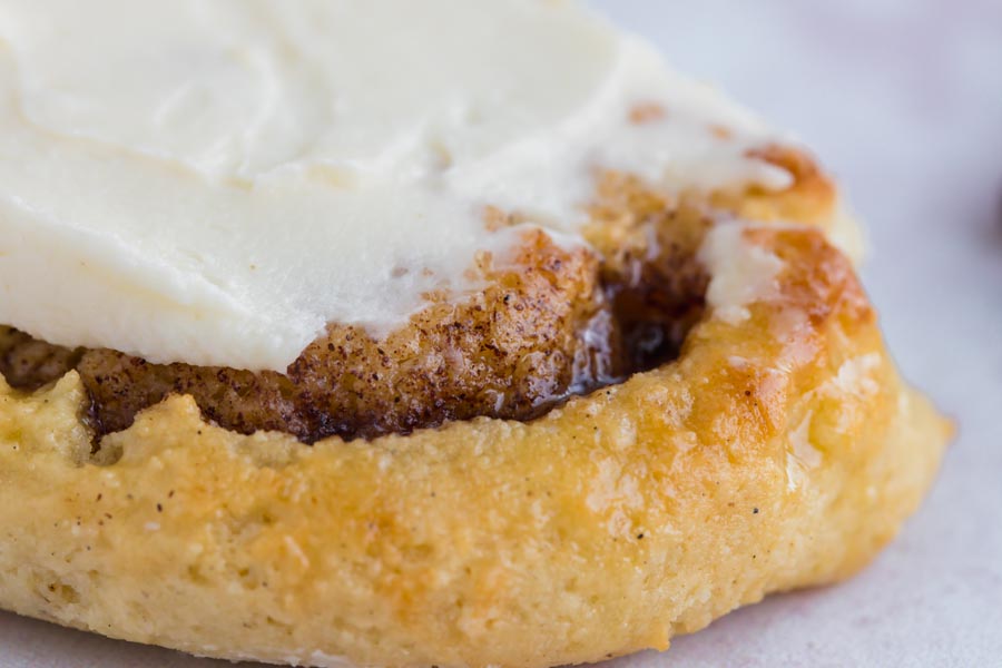 gooey warm cinnamon rolls topped with cream cheese frosting