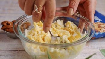 mixing a coconut dessert with a fork