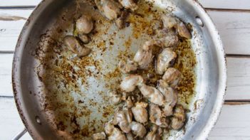 cooked chicken gizzards in a skillet