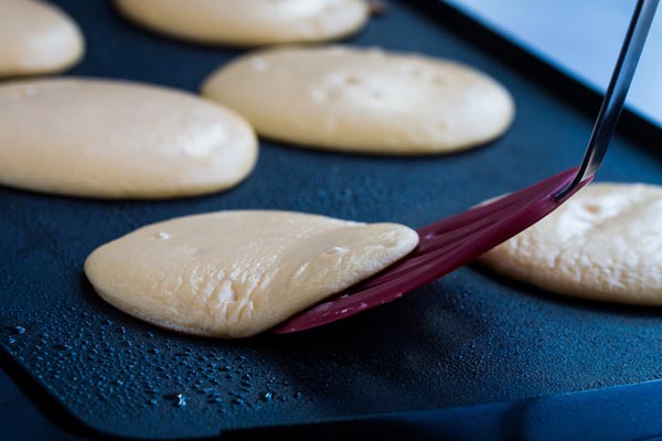 flipping a keto pancake with a spatula