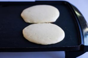 pancakes cooking on a skillet