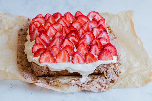 keto cheesecake crust exposed sitting on parchment paper