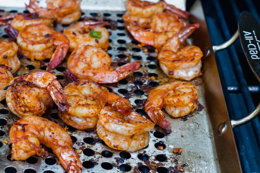 firecracker shrimp cooking on the grill