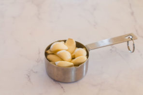 garlic in measuring cup