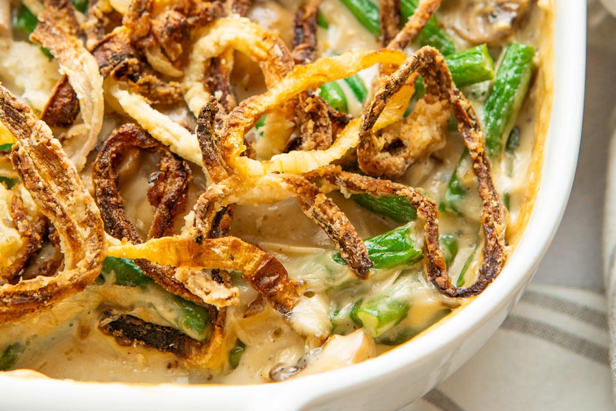 Close up of fried onions on top of green bean casserole.