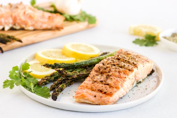 grilled salmon fillet served with asapargus on a plate