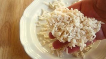 holding a shredded hash brown patty