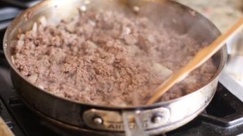 ground beef in a skillet cooking