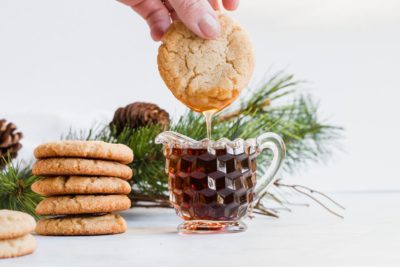 Dipping a bacon cookie in maple syrup