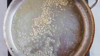 butter and garlic cooking in a skillet