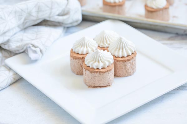 little chocolate treats on a plate with more in the background