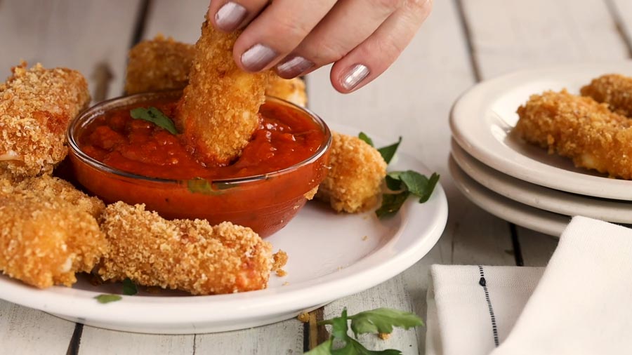 dipping cheese stick in marinara sauce