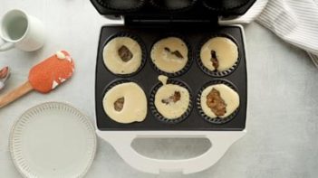 pouring pancake batter into a mini pie maker